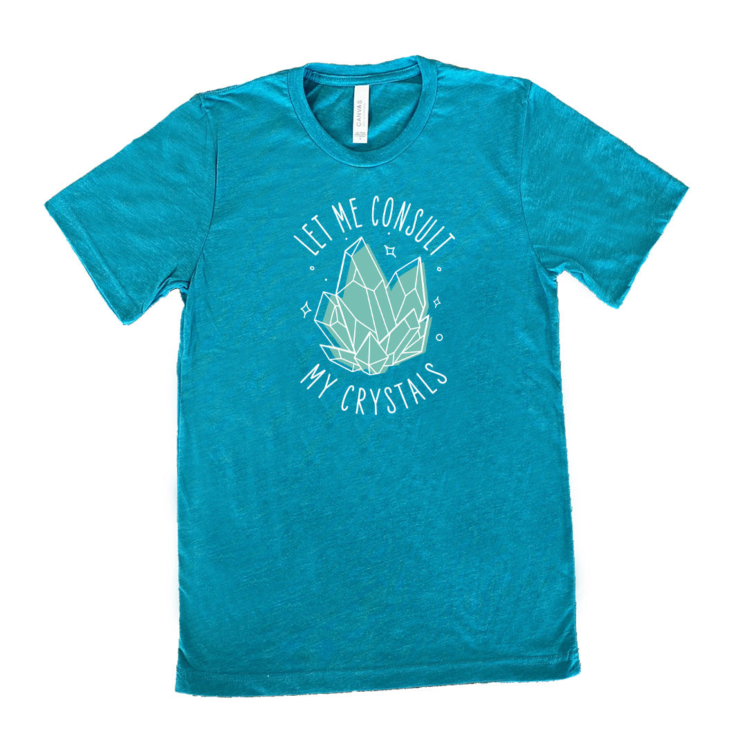 teal shirt with the text "Let Me Consult My Crystals" on it