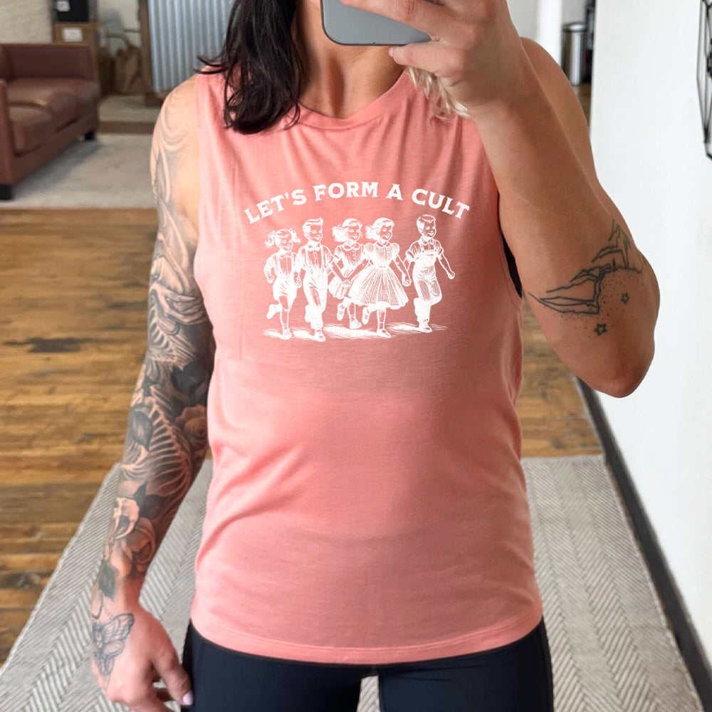 peach muscle tank with the text "Let's Form A Cult" on it