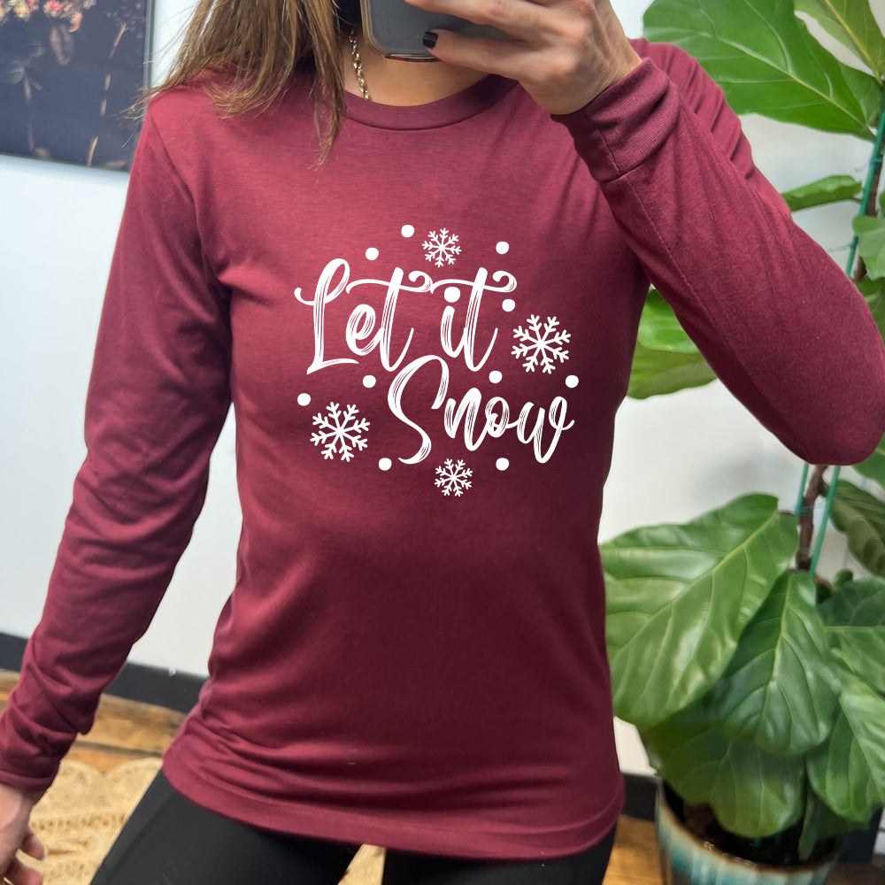 maroon long sleeve shirt with the text "Let It Snow" on it