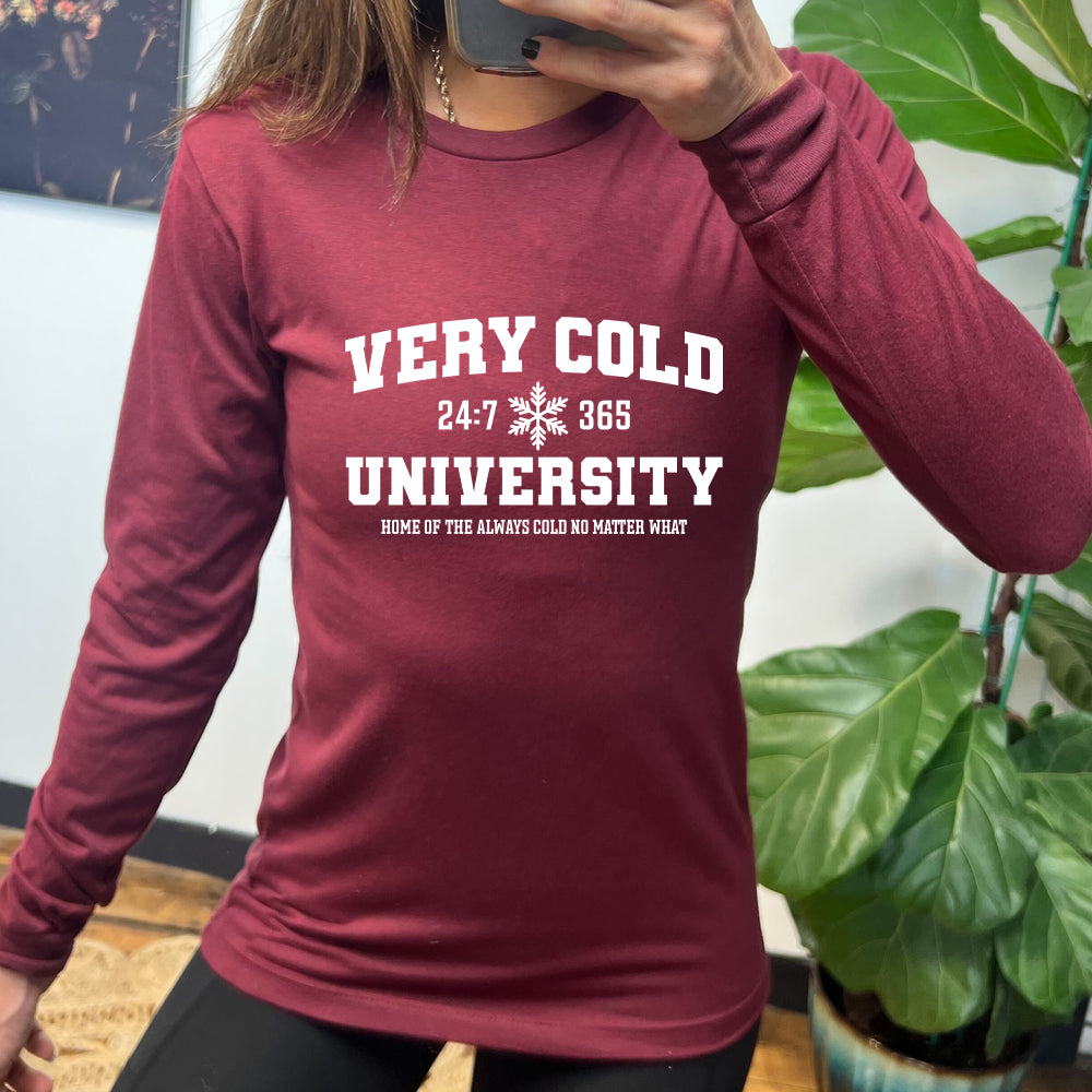 maroon long sleeve shirt with the text "Very Cold University" on it