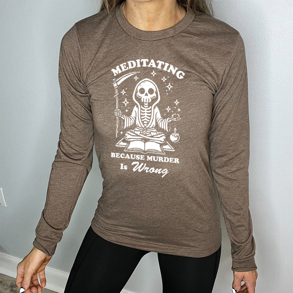 brown long sleeve shirt with the text "Meditating Because Murder is Wrong" on it