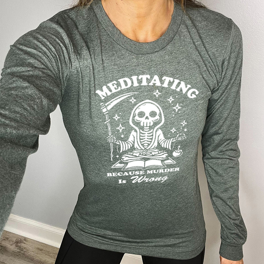 forest green long sleeve shirt with the text "Meditating Because Murder is Wrong" on it