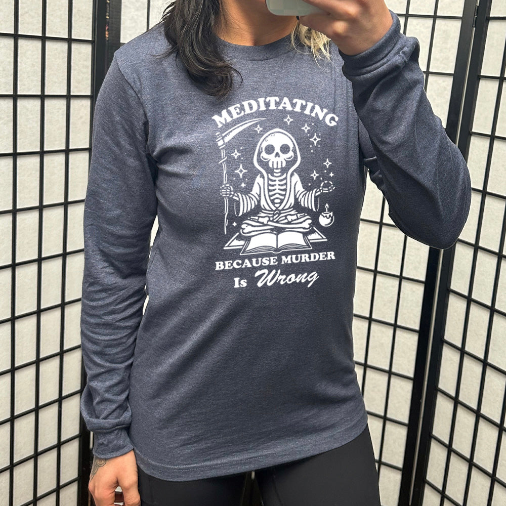 navy blue long sleeve shirt with the text "Meditating Because Murder is Wrong" on it