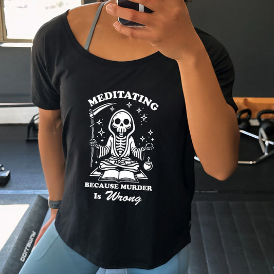 black slouchy shirt with the text "Meditating Because Murder is Wrong" on it