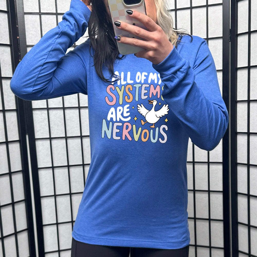 blue shirt with the text "All Of My Systems Are Nervous" on it