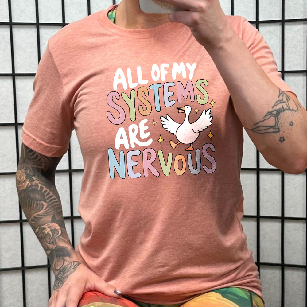 coral shirt with the text "All Of My Systems Are Nervous" on it