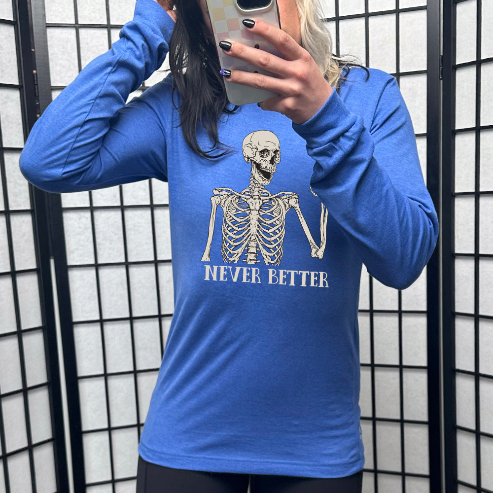 blue shirt with the text "Never Better" and a skeleton graphic on it 