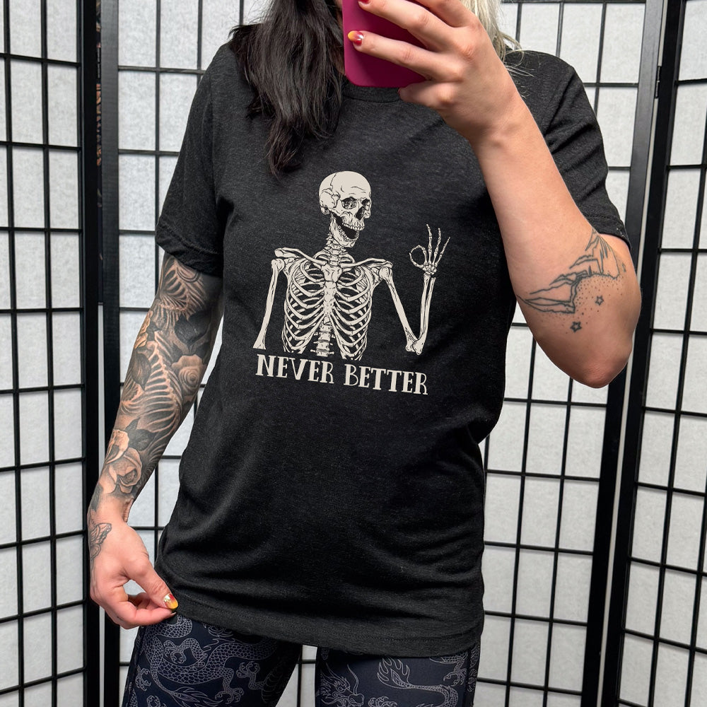 black shirt with the text "Never Better" and a skeleton graphic on it