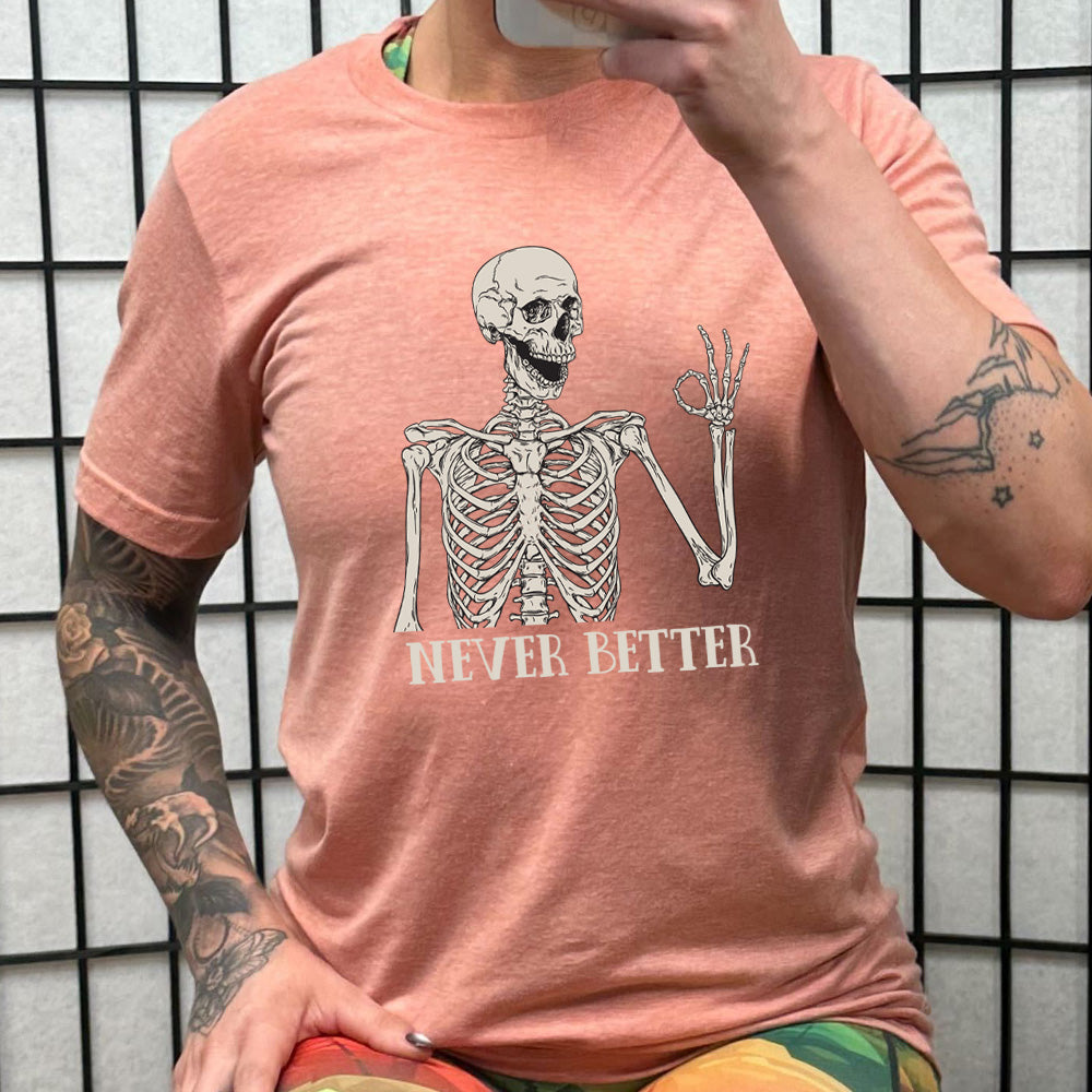 coral shirt with the text "Never Better" and a skeleton graphic on it