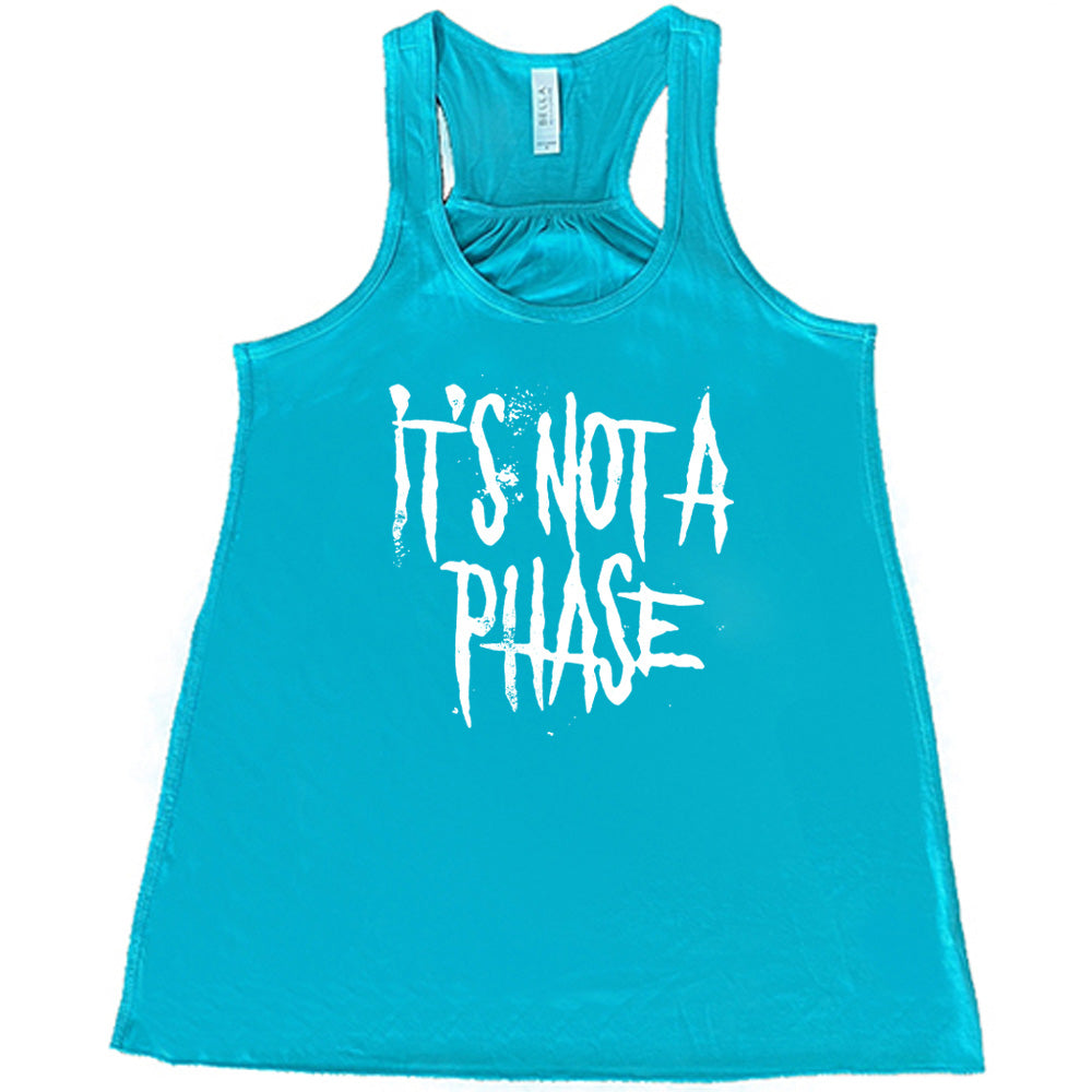 teal shirt with the text "It's Not A Phase" on it