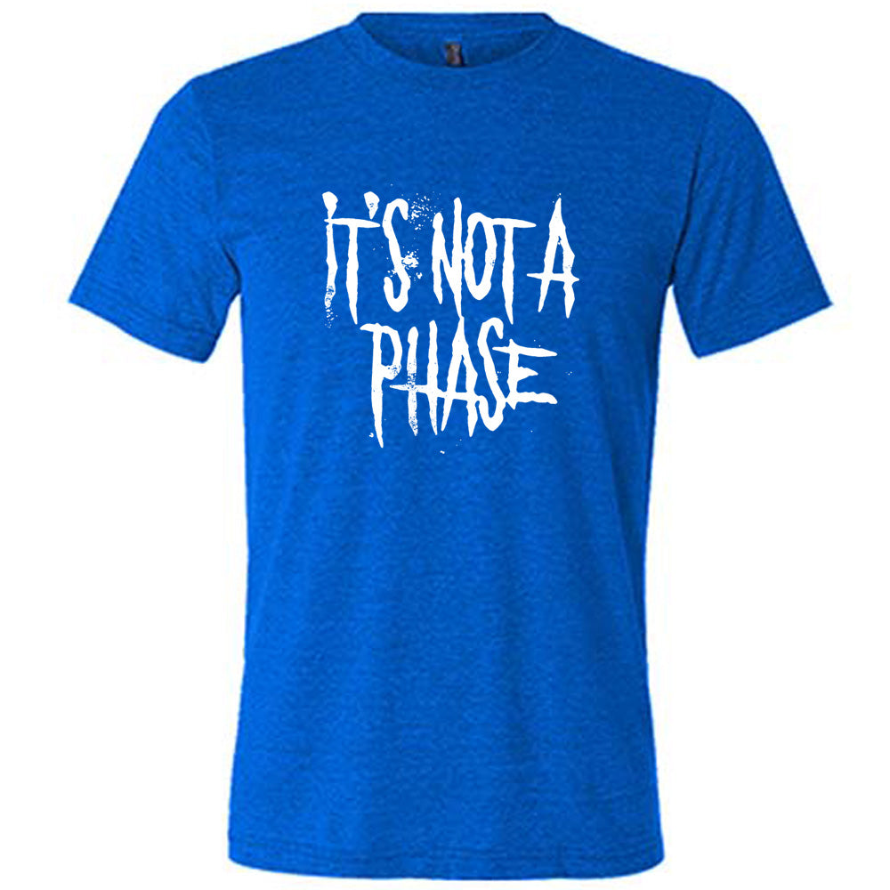 blue shirt with the text "It's Not A Phase" on it