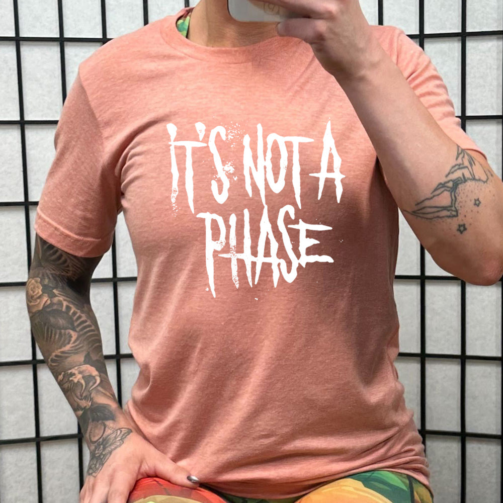 coral shirt with the text "It's Not A Phase" on it