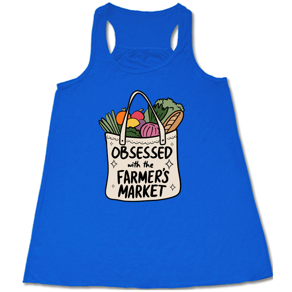 blue shirt with the text "Obsessed With The Farmer's Market" on it