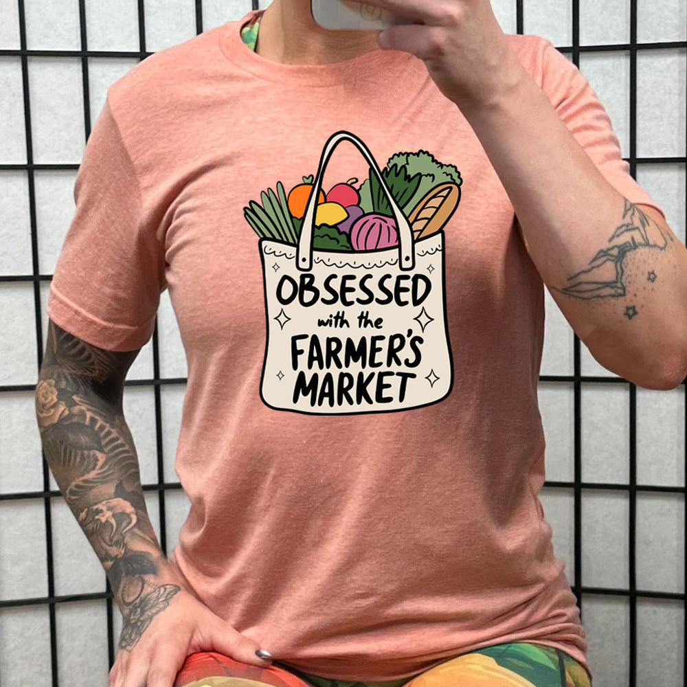 peach shirt with the text "Obsessed With The Farmer's Market" on it