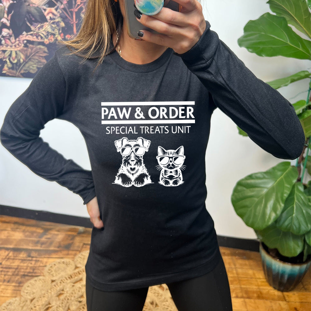 black shirt with the text "Paw & Order" and a graphic of a cat and dog on it