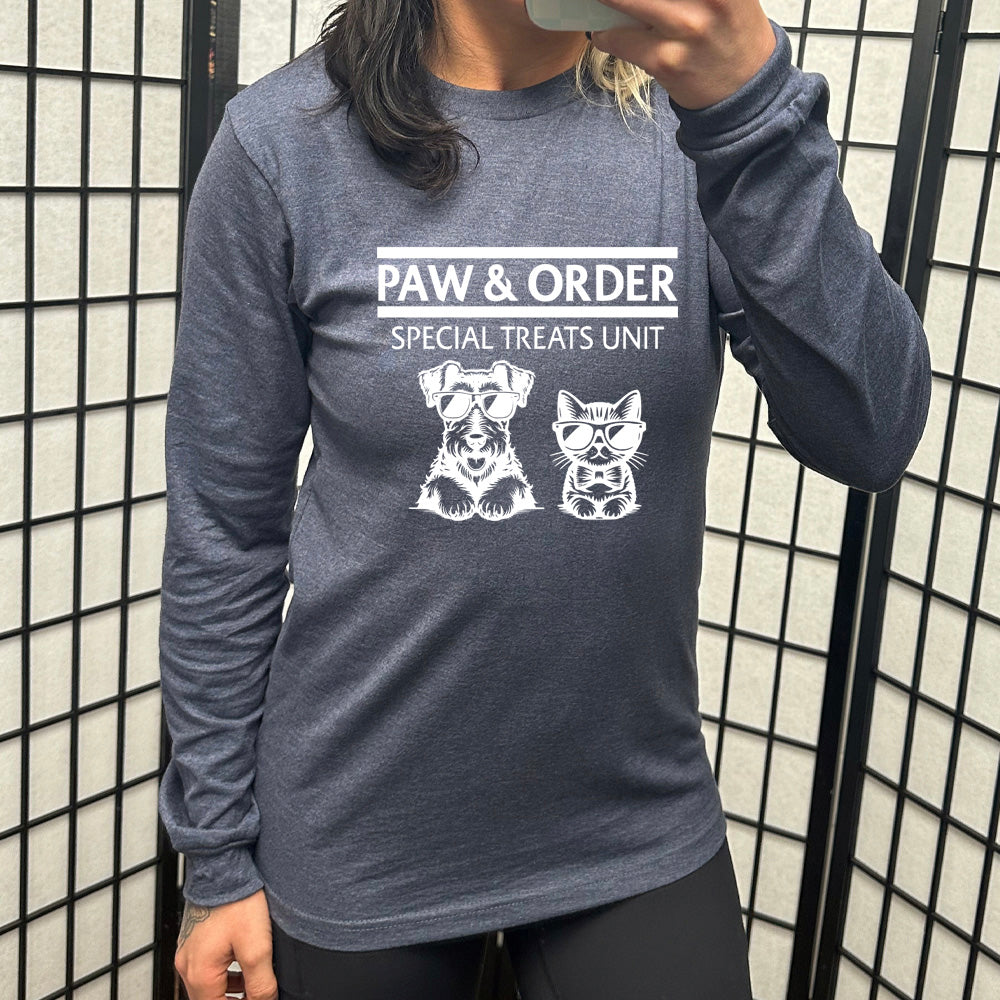 navy blue shirt with the text "Paw & Order" and a graphic of a cat and dog on it