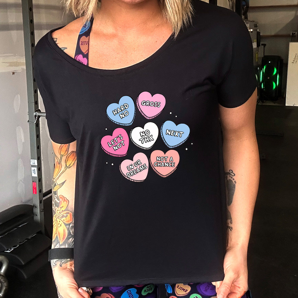 black slouchy shirt with cartoon valentine heart candy graphics on it 