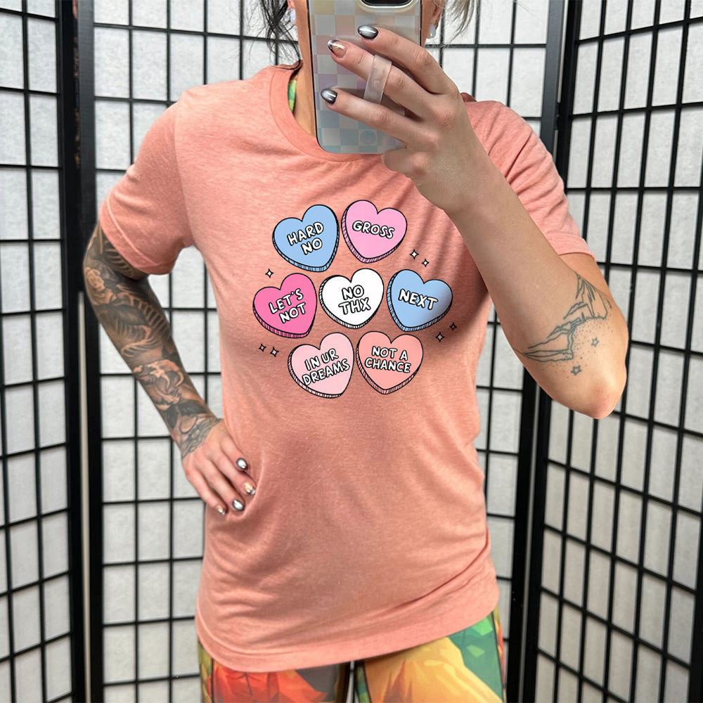 coral shirt with cartoon valentine heart candy graphics on it