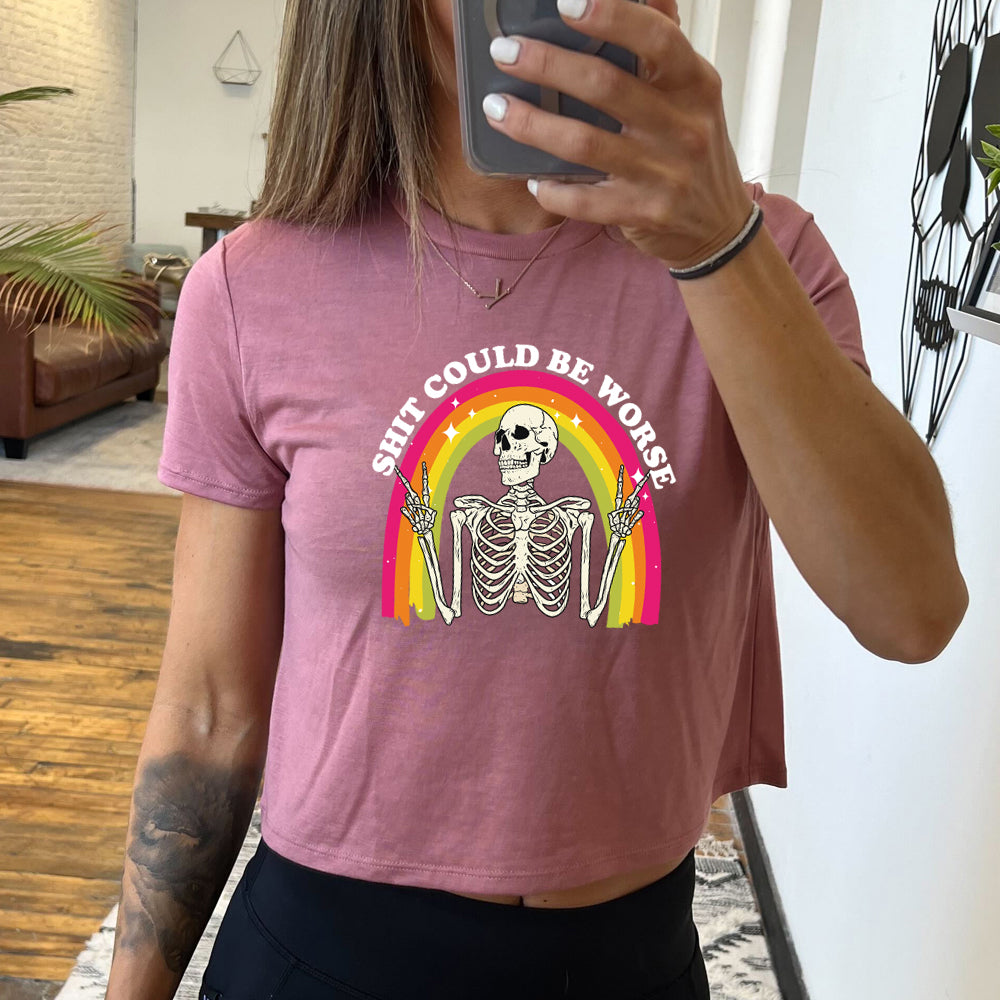 mauve cropped tee with the text "Shit Could Be Worse" on it