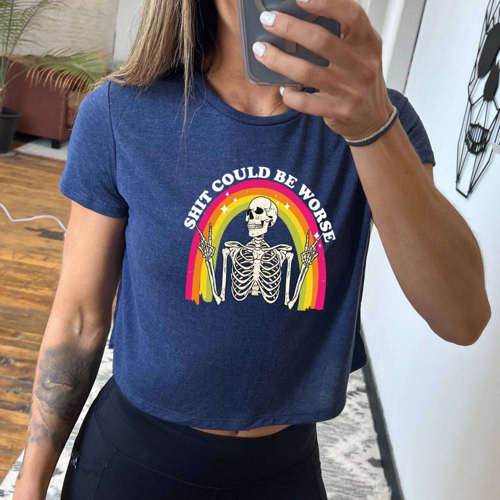 navy blue cropped tee with the text "Shit Could Be Worse" on it