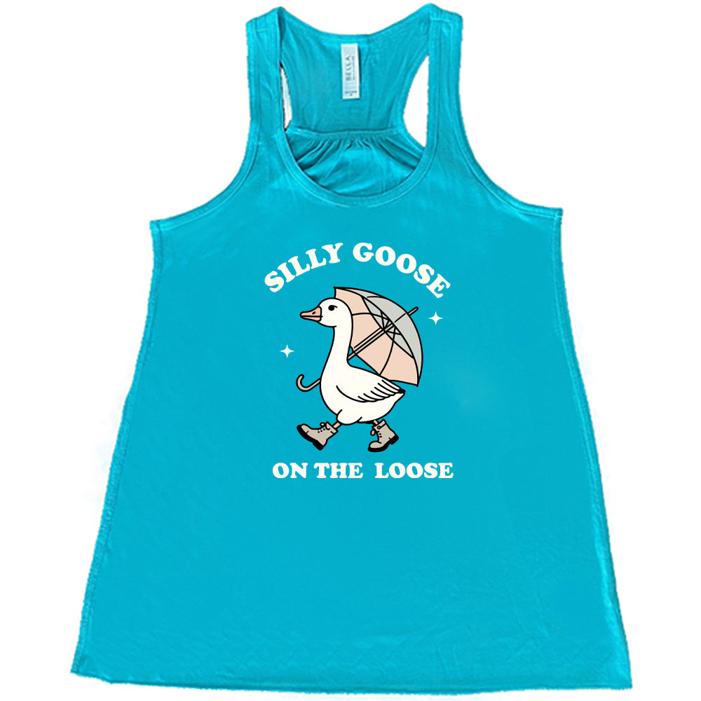 teal shirt with the text "Silly Goose On The Loose" on it