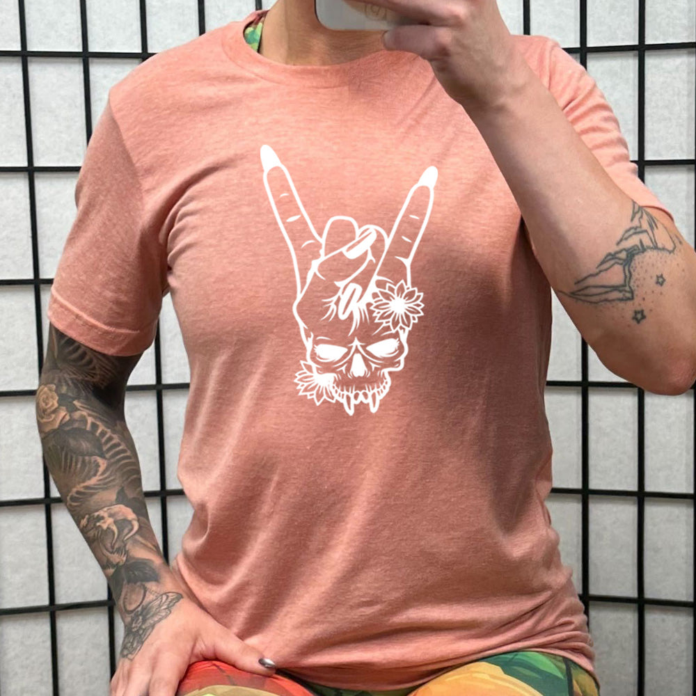 peach shirt with the "Skull Rocker Hand" graphic on it