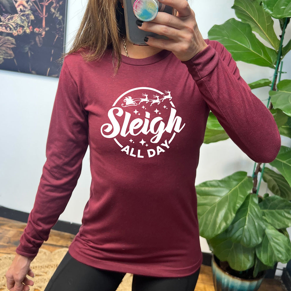 maroon long sleeve shirt with the text "Sleigh All Day" on it