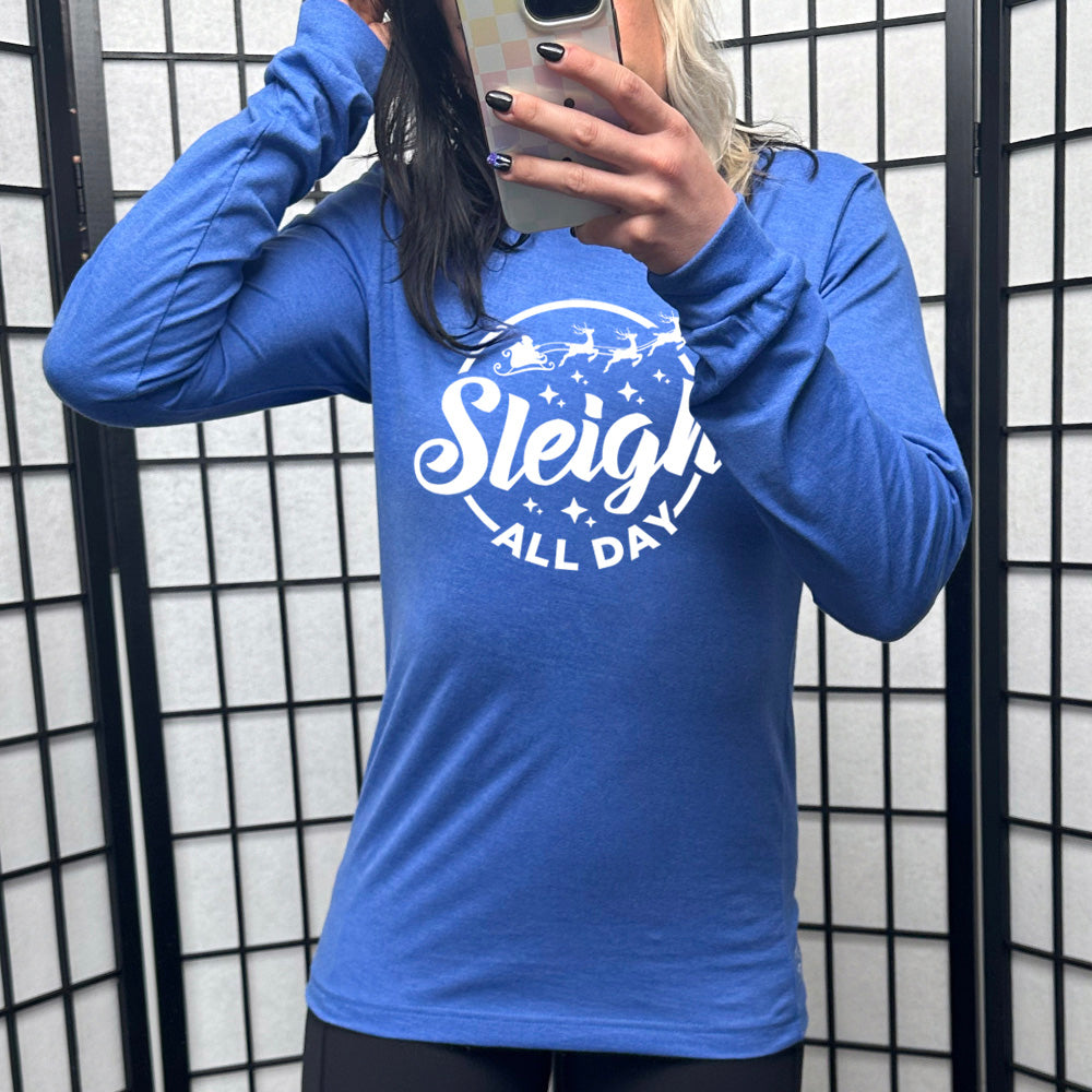 blue long sleeve shirt with the text "Sleigh All Day" on it