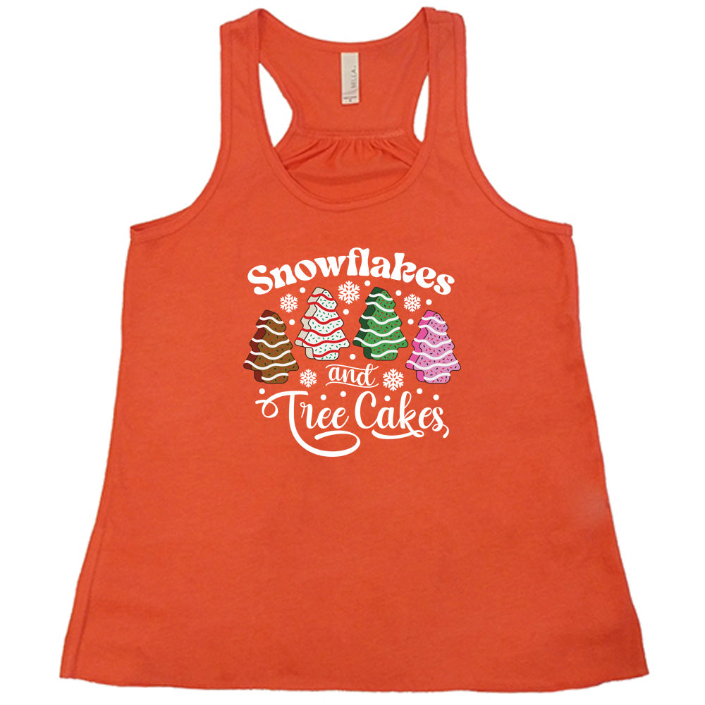 coral shirt with Snowflakes & Tree Cakes graphics on it