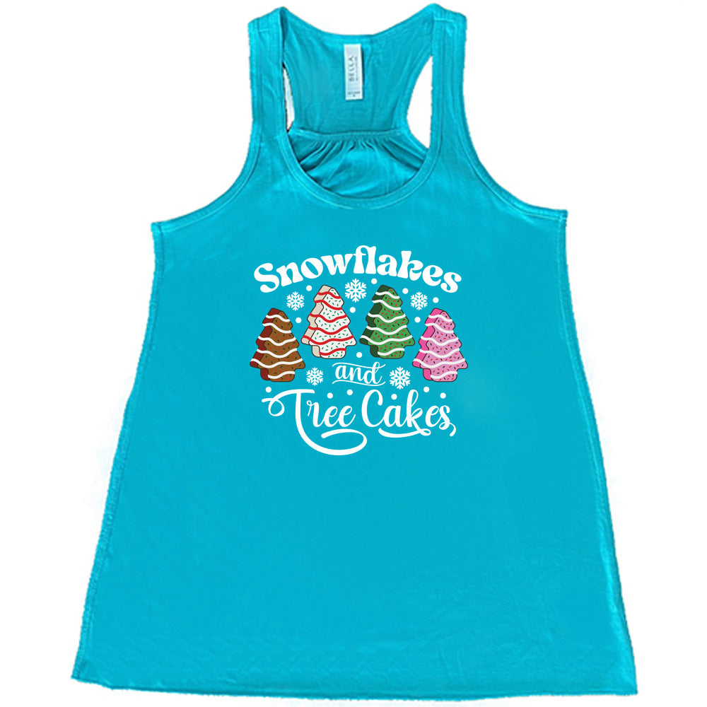 teal shirt with Snowflakes & Tree Cakes graphics on it