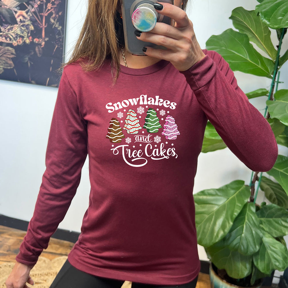 maroon long sleeve shirt with Snowflakes & Tree Cakes graphics on it