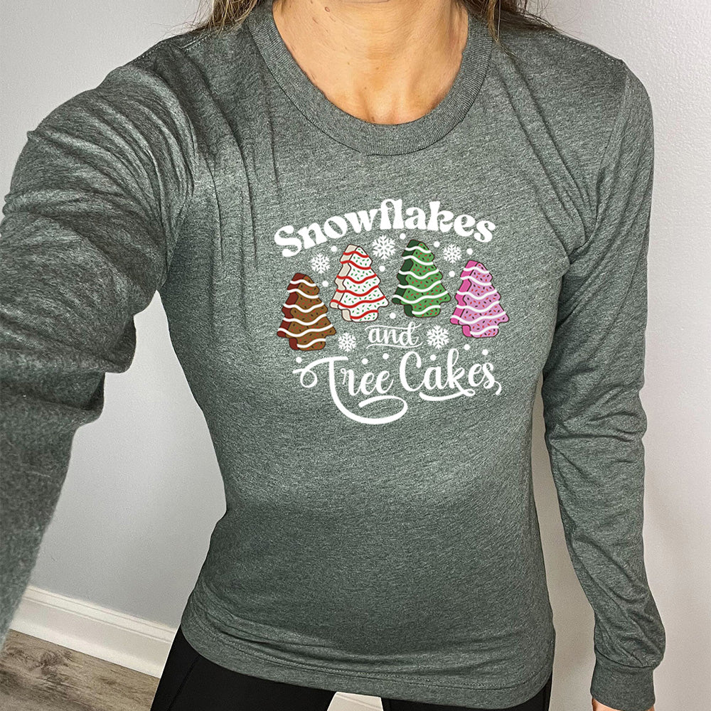 forest green long sleeve shirt with Snowflakes & Tree Cakes graphics on it