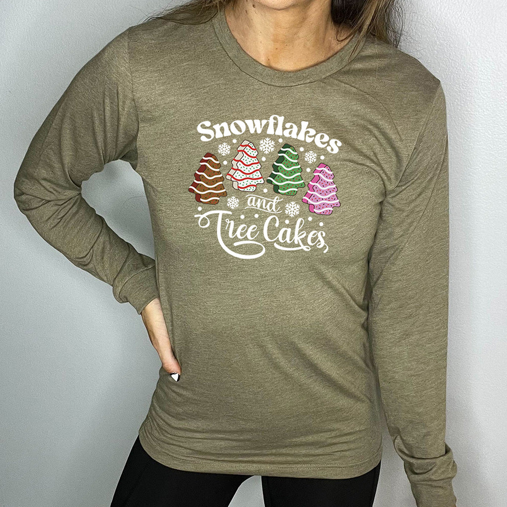 olive green long sleeve shirt with Snowflakes & Tree Cakes graphics on it