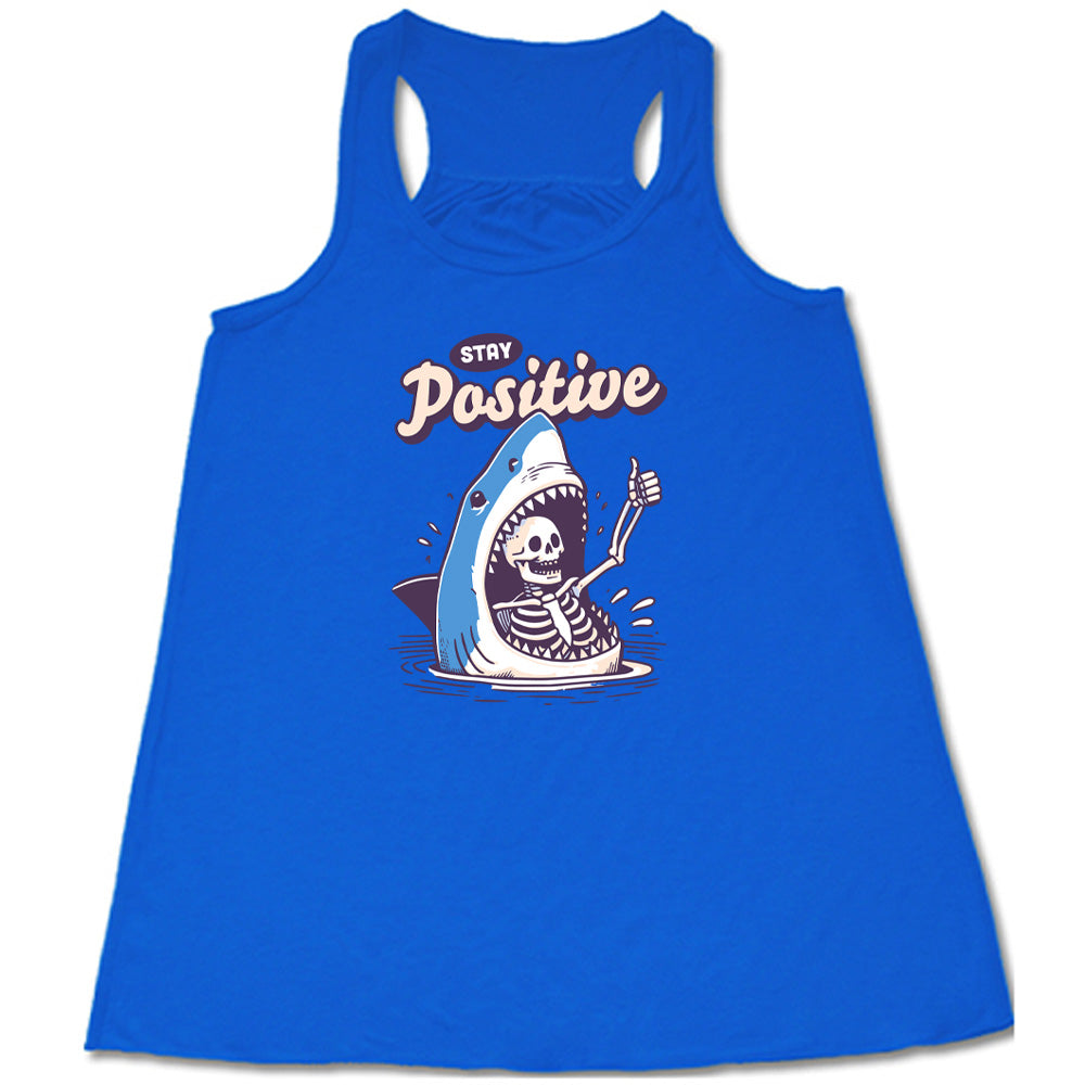 blue shirt with the text "Stay Positive" on it