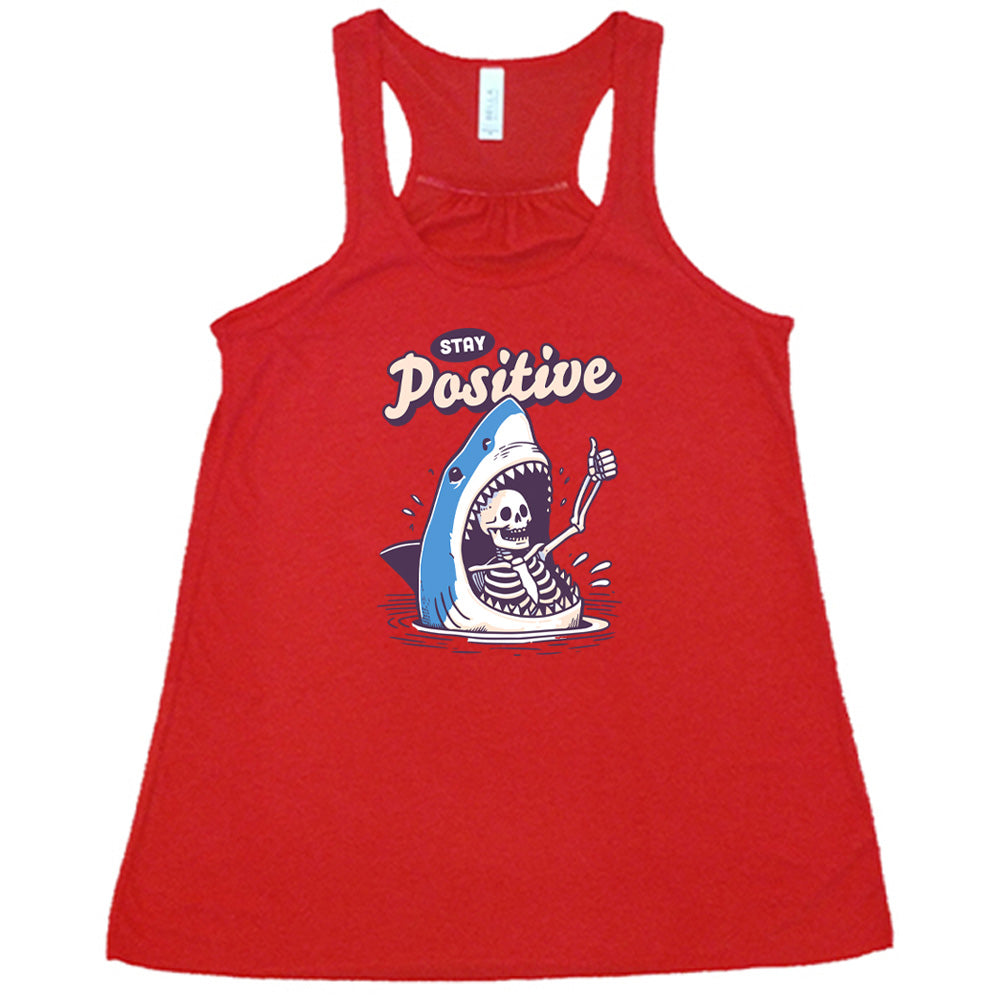 red shirt with the text "Stay Positive" on it