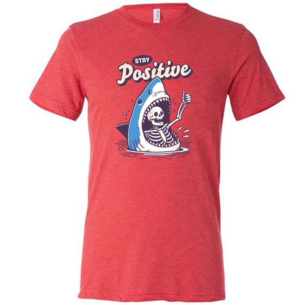 red shirt with the text "Stay Positive" on it