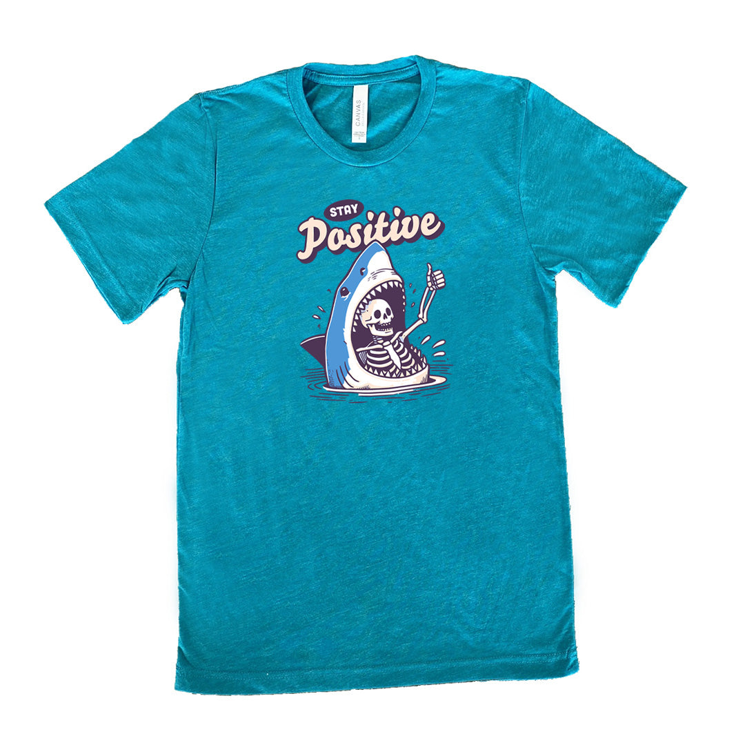 teal shirt with the text "Stay Positive" on it