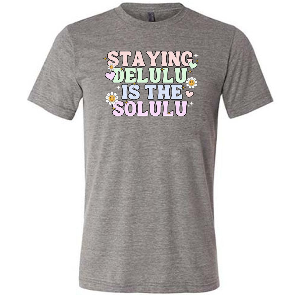 grey shirt with the text "Staying Delulu Is The Solulu" on it