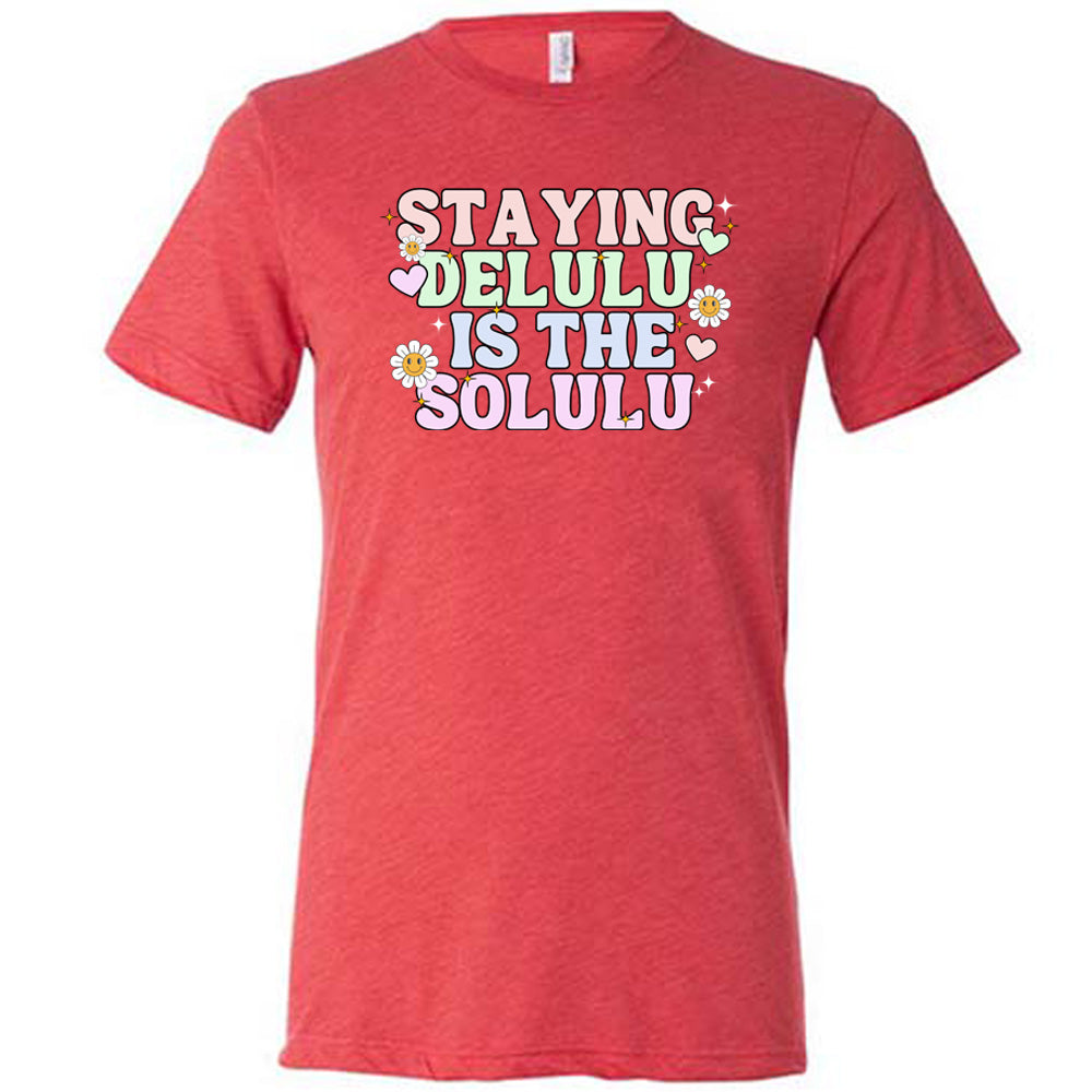 red shirt with the text "Staying Delulu Is The Solulu" on it