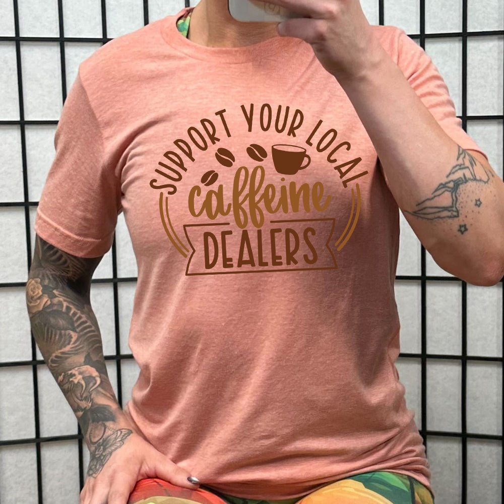 coral shirt with the text "Support Your Local Caffeine Dealers" on it