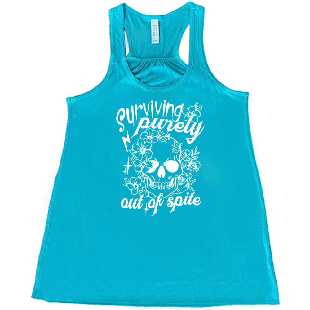 teal shirt with the quote "Surviving Purely Out Of Spite" on it