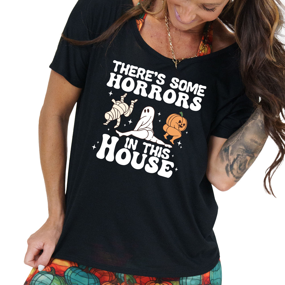 model wearing the black "There's Some Horrors In This House" slouchy shirt