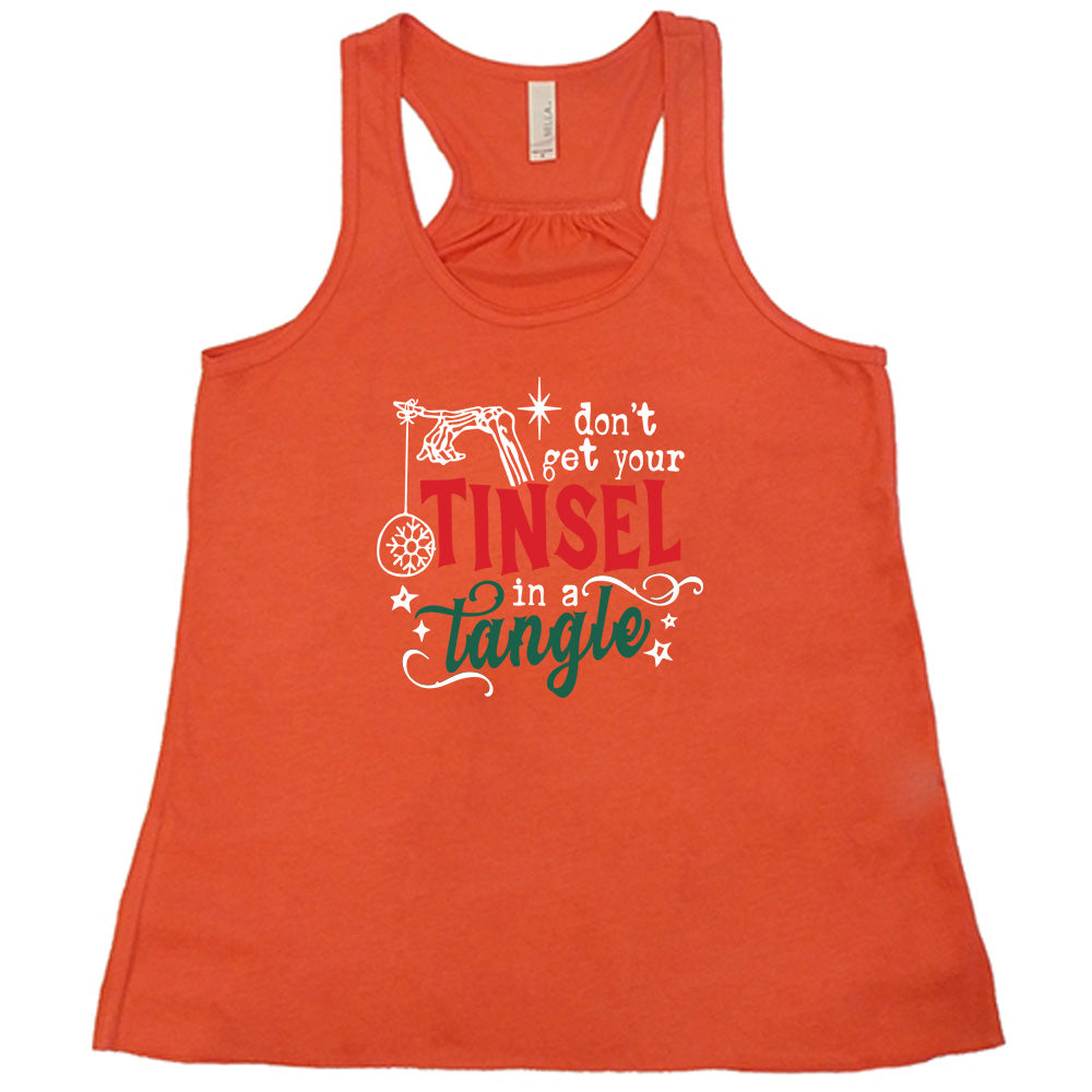 coral shirt with the text "Don't Get Your Tinsel In A Tangle" on it