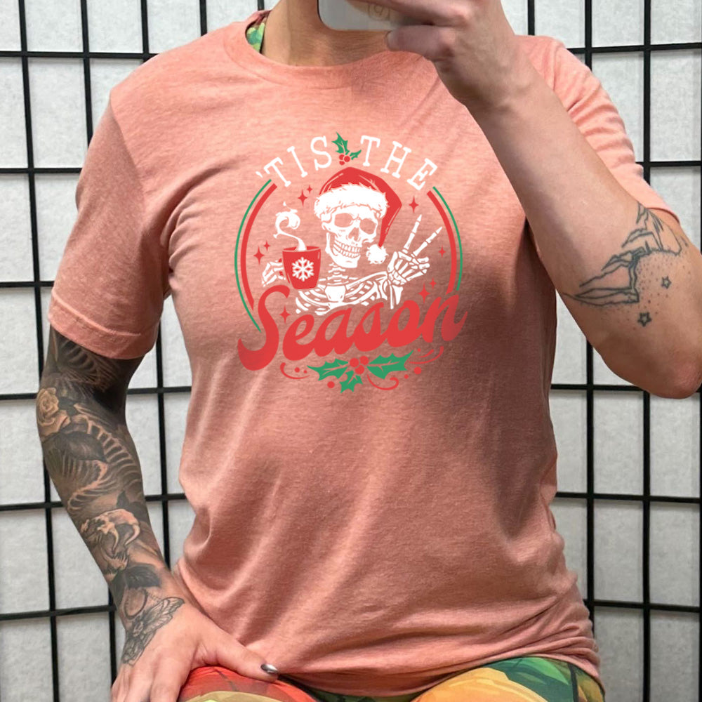 peach shirt with the text "Tis The Season" on it