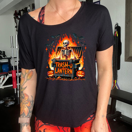 black slouchy shirt with a skeleton graphic and the quote "trash-o lantern" on it