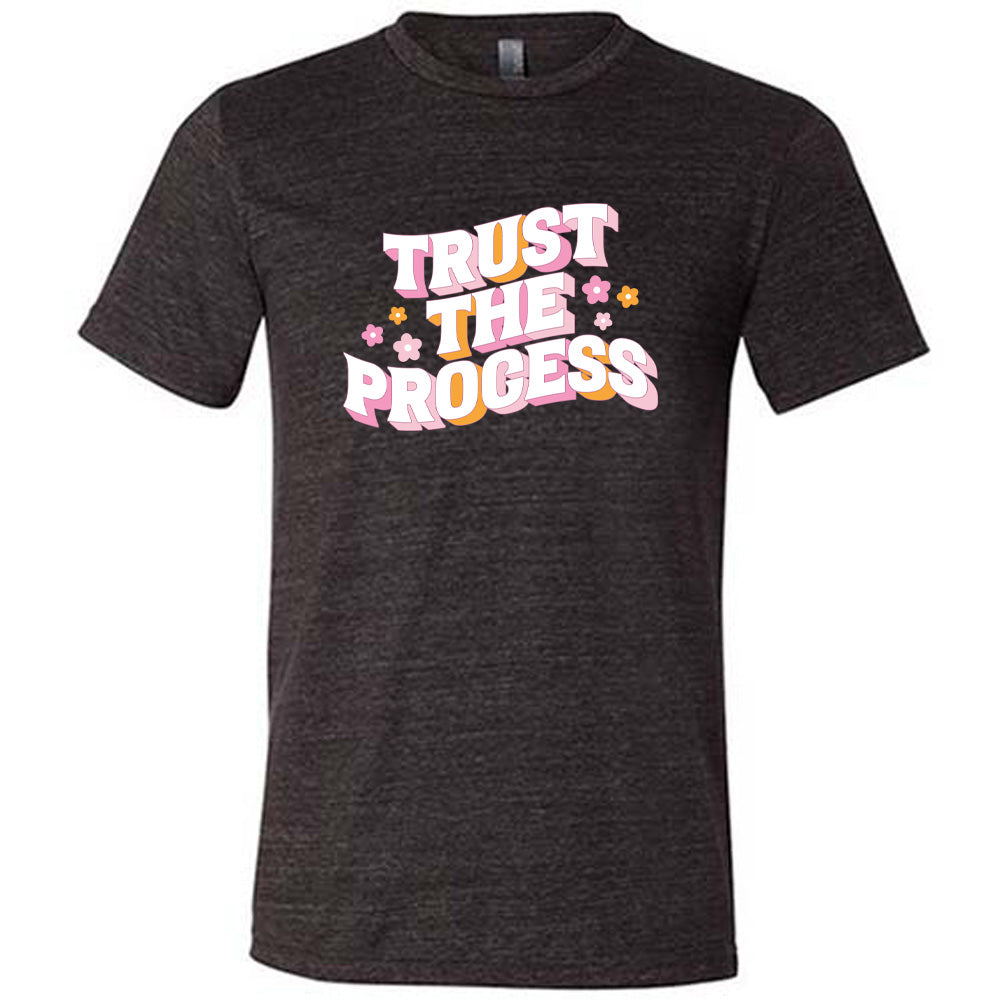 black shirt with the text "Trust The Process" on it