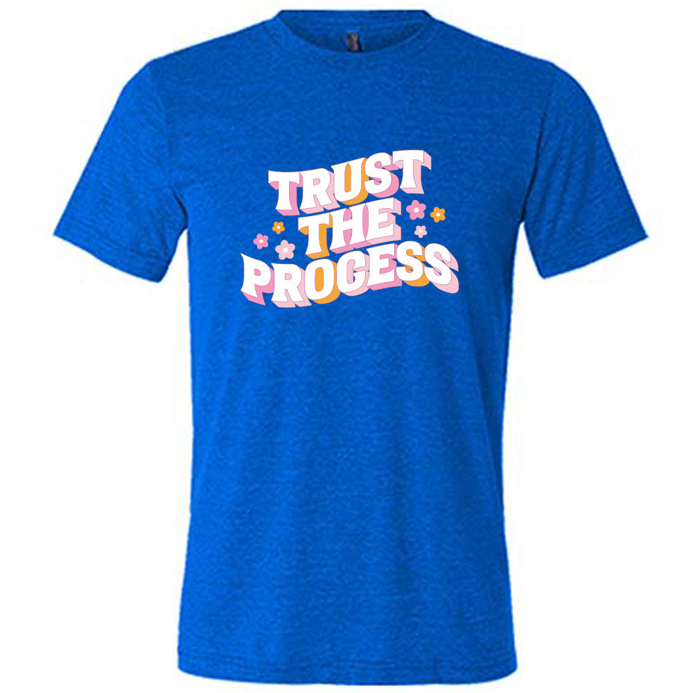 blue shirt with the text "Trust The Process" on it