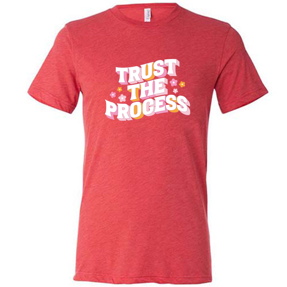 red shirt with the text "Trust The Process" on it