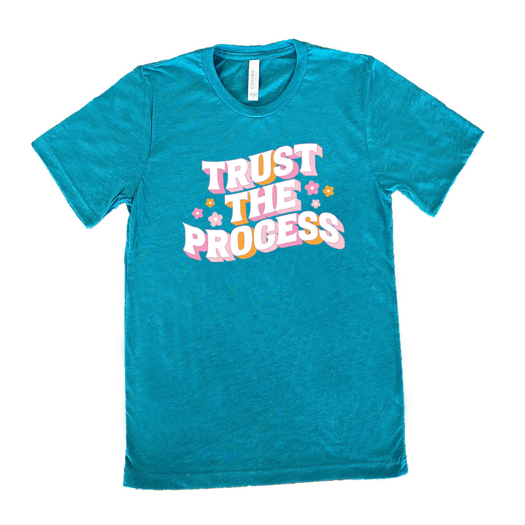 teal shirt with the text "Trust The Process" on it