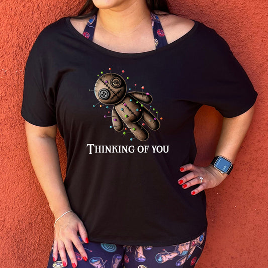 slouchy shirt with the quote "Thinking Of You" on it